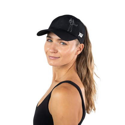 T holding K Ponytail Caps